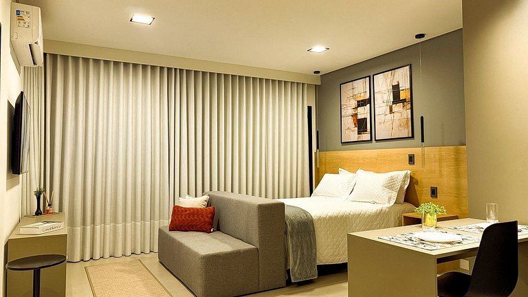 64B Studio premium aconchegante com sofá-cama